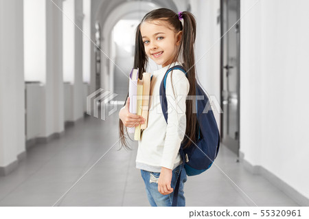 Pretty and cute school girl with funny hairstyle. Pretty and cute school girl with funny hairstyle. 55320961