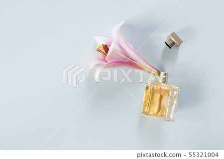 Luxury bottle of perfume with fresh lily flowers Luxury bottle of perfume with fresh lily flowers 55321004