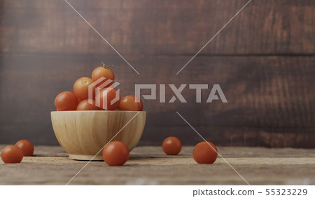 Group ripe tomato in a wood bowl place on the 55323229