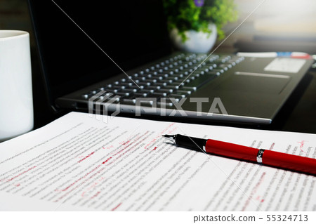 blur proofreading sheet on table 55324713