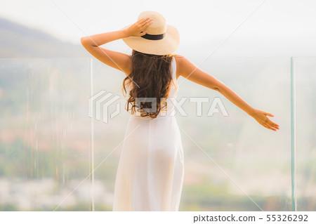 Portrait beautiful young asian woman happy smile relax on the roof top bar 55326292