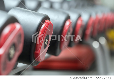 Dumbbells in gym ready for workout,Selective focus 55327455