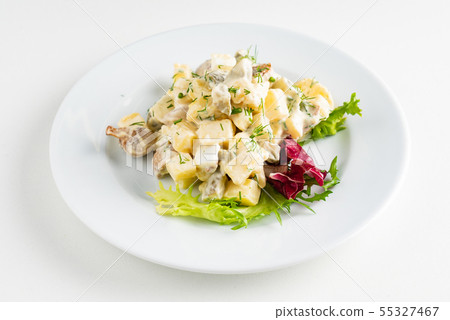 Traditional salad with cooked vegetables with mayonnaise. 55327467