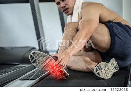 Asian man injury foot pain have a Muscle Cramp 55328088