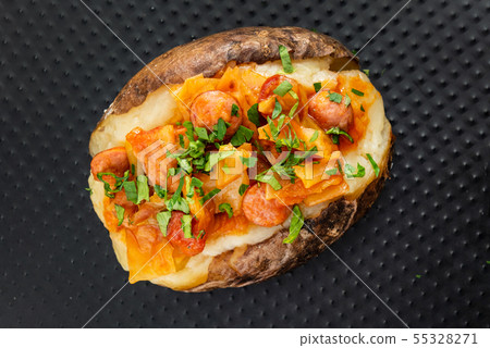 baked potato on the black background baked potato on the black background 55328271