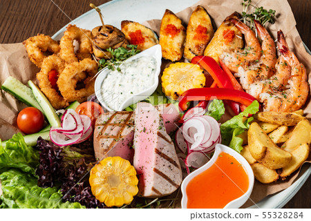 seafood plate on the wooden background seafood plate on the wooden background 55328284