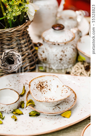 Ceramic tableware on the table 55328823