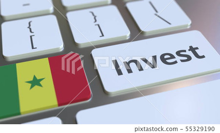 INVEST text and flag of Senegal on the buttons on the computer keyboard. Business related conceptual 55329190