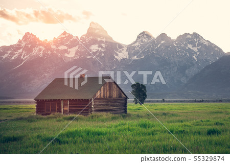 Old wooden house in mountains at summer sunset Old wooden house in mountains at summer sunset 55329874