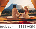 Asian couple enjoying outdoor camping Watching the 55330090