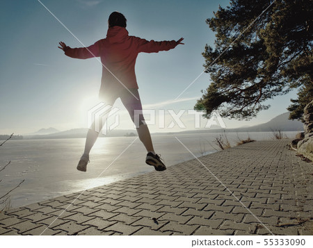 Athletic fitness woman jumping and running on 55333090