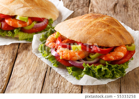 Pita with king prawns, summer vegetables close-up Pita with king prawns, summer vegetables close-up 55333258