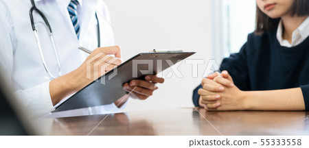 Close up of doctor and patient sitting hands Close up of doctor and patient sitting hands 55333558