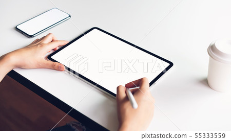 Woman using tablet screen blank and smartphone Woman using tablet screen blank and smartphone 55333559