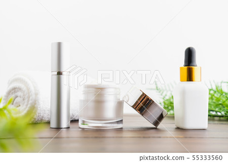 White serum bottle and cream jar, mockup of beauty White serum bottle and cream jar, mockup of beauty 55333560