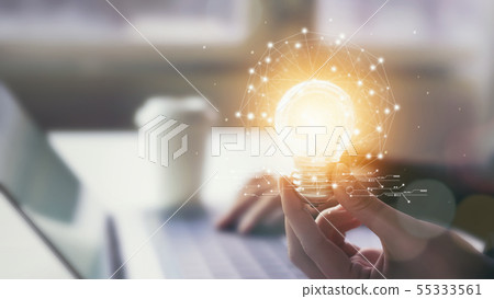 Hand holding light bulb with innovative Hand holding light bulb with innovative 55333561