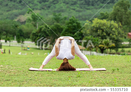 woman practice yoga Spread foot stretching pose 55335710