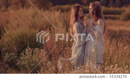 Portrait of two girls on the background of the sum 55338270
