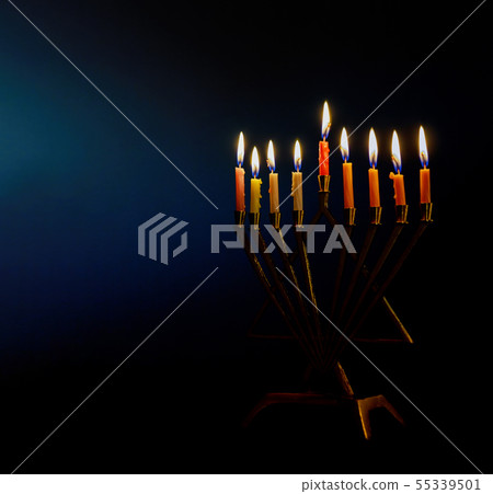 Golden menorah lighted candles on menorah for the 55339501