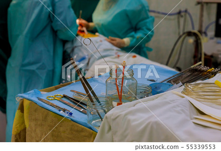 Surgical instruments on table for operation with Surgical instruments on table for operation with 55339553