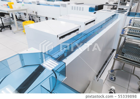 Blood samples move on the tray in lab 55339898