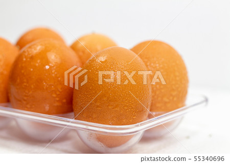 Close up of wet clean chicken eggs in a plastic 55340696