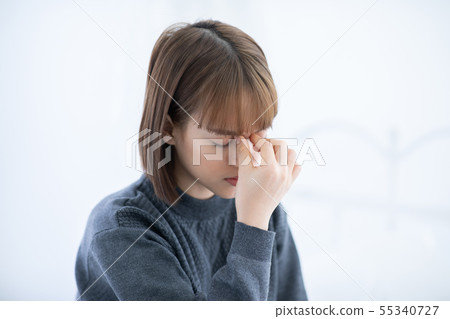 Woman has a Migraine and headache 55340727