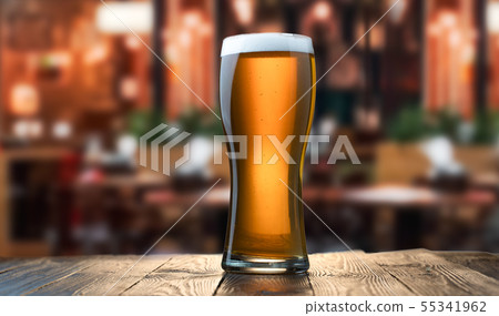 Frosty glass of light beer 55341962