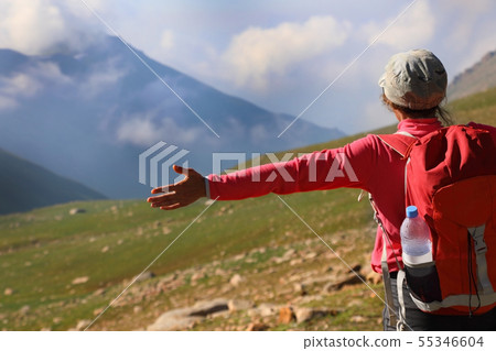 Female backpacker in the mountains Female backpacker in the mountains 55346604