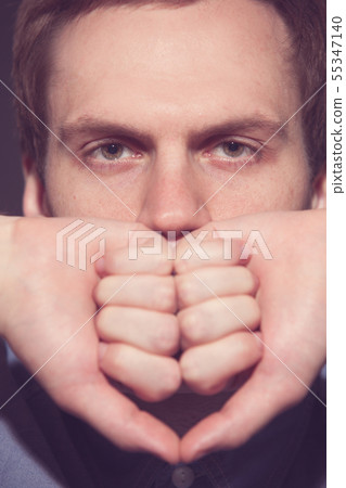 Speak no evil concept - Face of men covering his mouth. 55347140