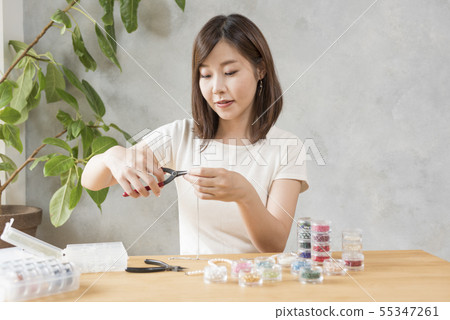 Women making bead accessories Women making bead accessories 55347261