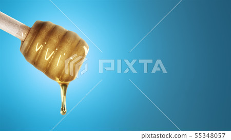 Honey dripping from honey dipper on blue background Honey dripping from honey dipper on blue background 55348057