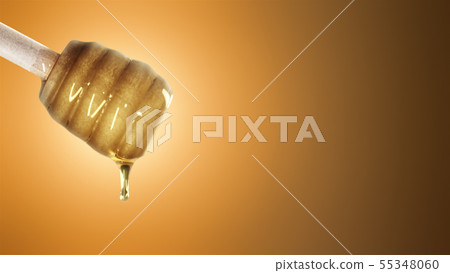 Honey dripping from honey dipper on orange background Honey dripping from honey dipper on orange background 55348060
