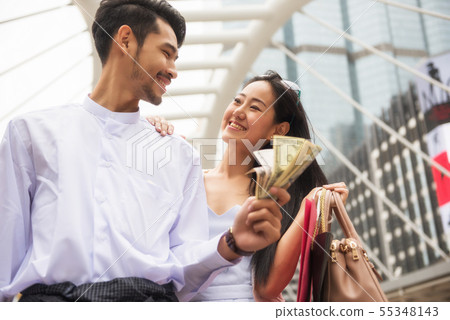 Myanmar couple shopping in city Myanmar couple shopping in city 55348143