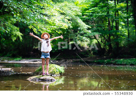 Girls playing on the river 55348930