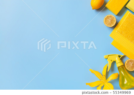 Blue background with cleaning supplies and lemons 55349969