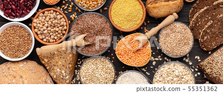 Gluten free different grains and bread on wooden background Gluten free different grains and bread on wooden background 55351362