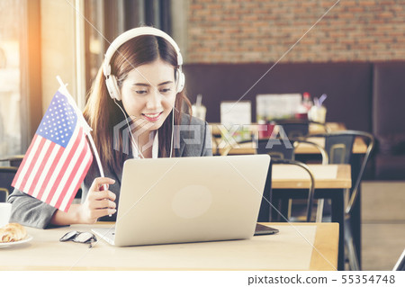 Young american woman using laptop celebrate on 4th 55354748