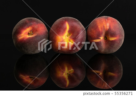 Fresh red peach isolated on black glass Fresh red peach isolated on black glass 55356271