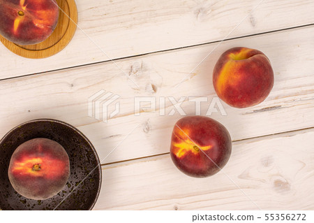Fresh red peach on grey wood Fresh red peach on grey wood 55356272