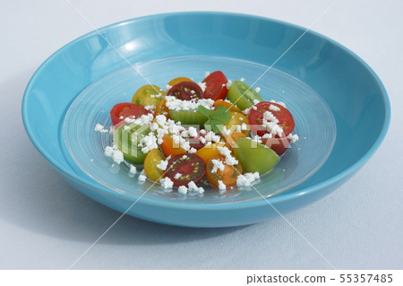 Cottage cheese with colorful tomatoes 55357485