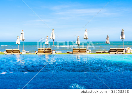 Beautiful outdoor nature landscape with bed deck chair around swimming pool in hotel resort 55358258