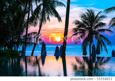 Beautiful outdoor tropical nature landscape of swimming pool in hotel resort with coconut palm tree umbrella and chair nearly sea ocean beach Beautiful outdoor tropical nature landscape of swimming pool in hotel resort with coconut palm tree umbrella and chair nearly sea ocean beach 55358651