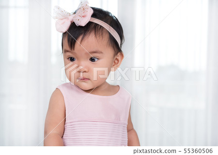 baby in pink dress baby in pink dress 55360506