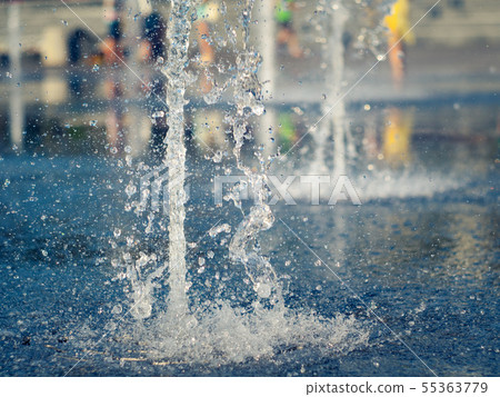 Close up view on water streams beating out of Close up view on water streams beating out of 55363779