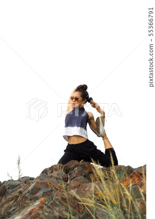 Yoga Gymnastics on the rock in white sky. 55366791