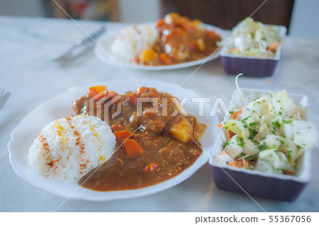 Typical spicy Japanese curry rice with salad 55367056
