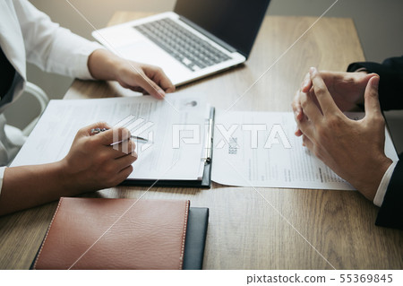 Female employee are describing the employment 55369845