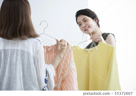 Young woman choosing clothes Young woman choosing clothes 55372607