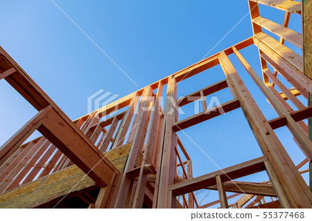 Looking up new construction beams under a clear Looking up new construction beams under a clear 55377468